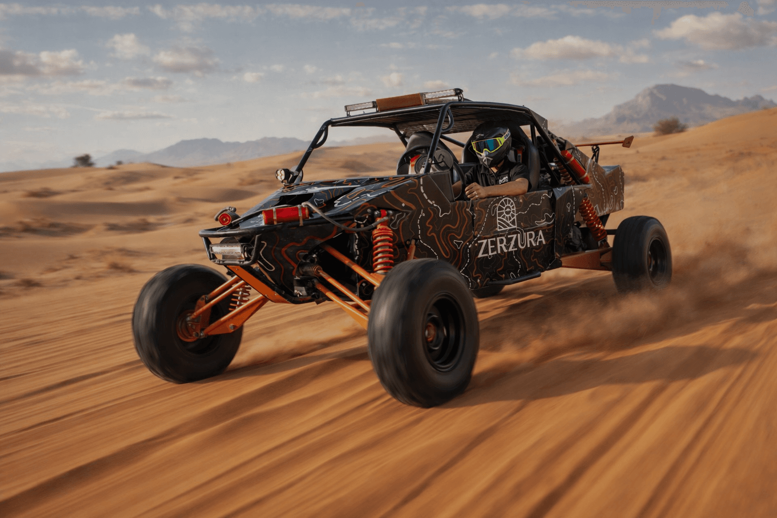Zerzura self drive dune buggy speeding across Mleiha desert dunes