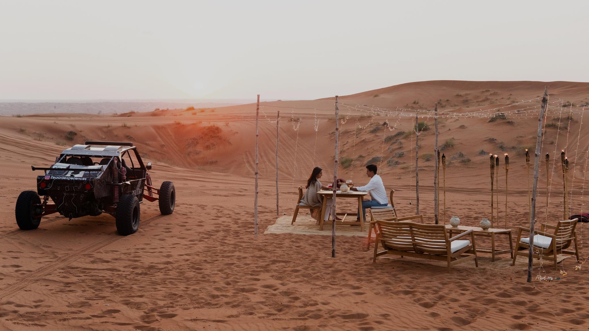 Luxury private dinner setup in Mleiha desert during Zerzura dune buggy experience