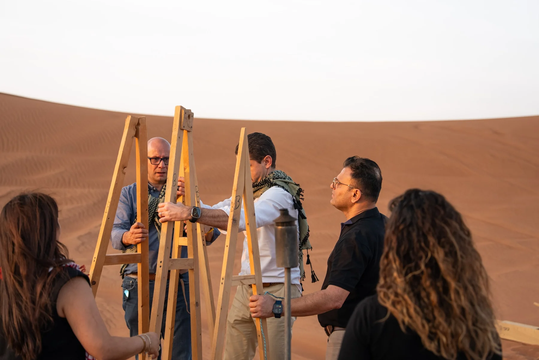 A team constructing a wooden model during the Oil Hunt activity