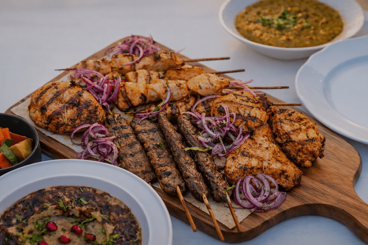 Arabic and Emirati dinner platter served with table service at Zerzura camp