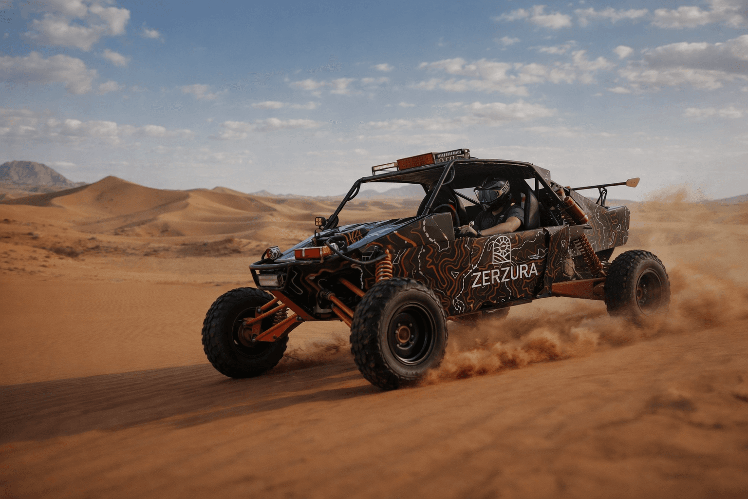 Zerzura dune buggy driving across Mleiha desert dunes during adventure tour
