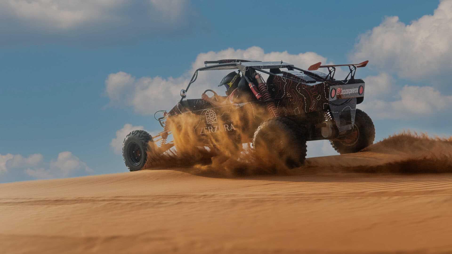 Zerzura dune buggy tour driving through Mleiha desert dunes near Dubai