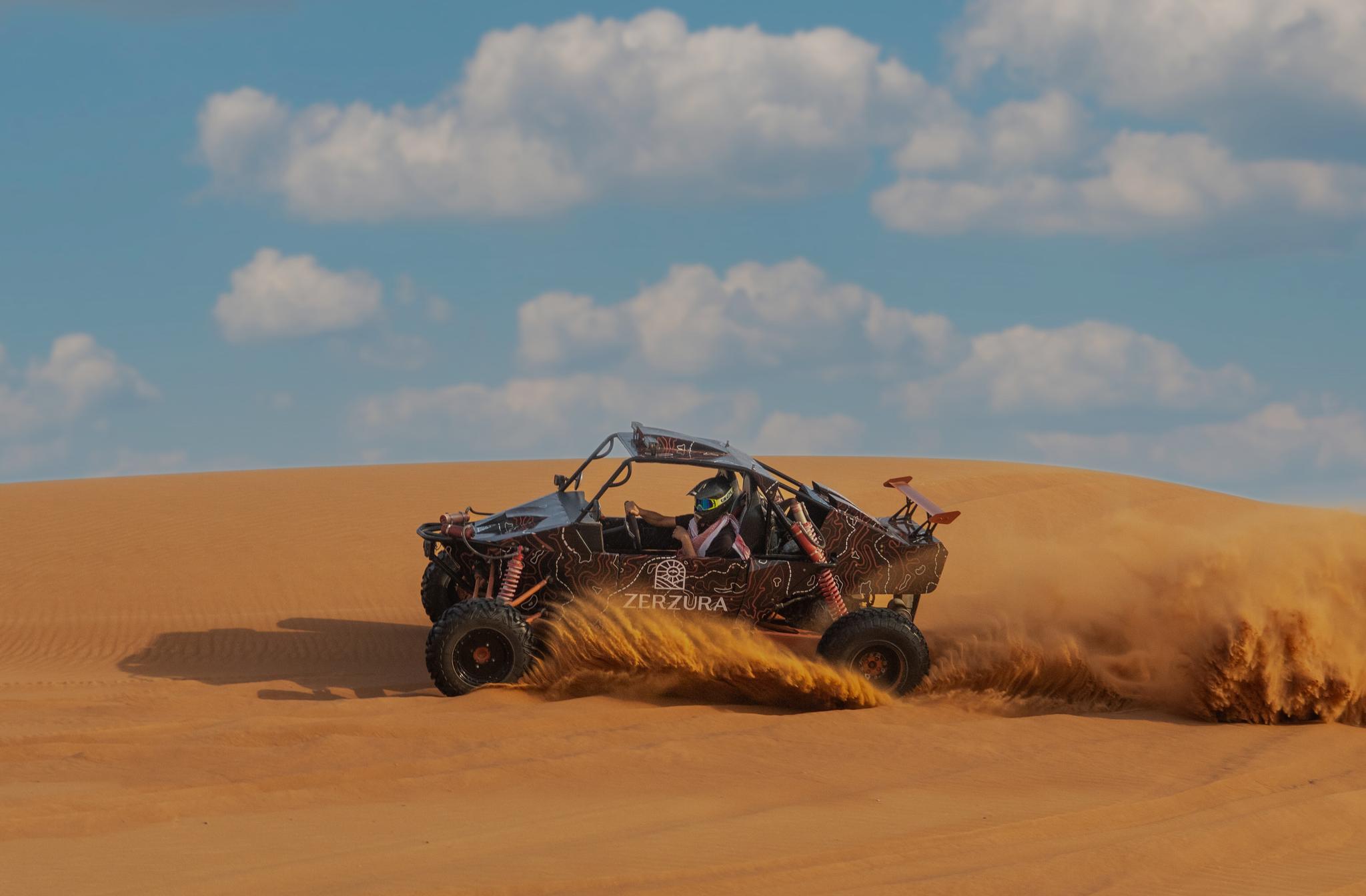 Zerzura dune buggy parked near desert camp during Mleiha desert adventure